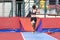 Young woman athlete performs the high jump pole vault