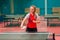 Young woman athlete plays ping pong