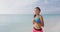 Young woman athlete running on beach exercising - female runner