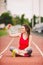 Young woman athlete at the stadium sporting lifestyle, sitting on the track, taking selfie photo on a smartphone