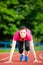 Young woman athlete in starting position