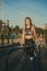 A young woman of athletic physique is doing an exercise on the uneven bars