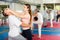 Young woman attacking eyes of male sparring partner in self-defense workout