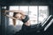 Young woman attractive fitness exercise workout in gym. Woman stretching the muscles and relaxing
