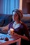 Young woman attuning with closed eyes to Tarot card reading