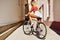 Young woman back on sport fixed gear bicycle posing on outd