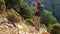 Young woman with backpack walk the Lycian way hiking trail in Turkey.