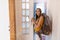 Young woman with backpack at youth hostel