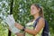 Young woman backpacker checking map