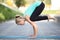 Young woman in a Bakasana pose