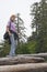 Young Woman balancing on driftwood