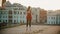 Young woman ballerina training on the roof - standing on her tiptoes