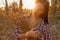 Young Woman With Banch Of Wildflowers In Her Hands Backlit. Vintage Color Image