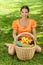 Young woman with baskets of fruit