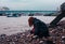 Young woman beachcombing in city