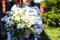 Young woman with a beautiful birthday flowers bouquet