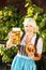 Young woman with beer glasses and bretzel