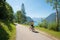 Young woman on bike way at lakeside Achensee east with mountain view