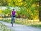 Young woman biking in spring