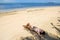 Young woman in bikini lying on the beach on Makaha`a island near