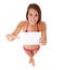 Young woman in bikini pointing at blank sign
