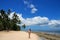 Young woman in bikini standing on the beach of Makaha`a island n