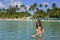 Young woman in bikini standing in clear water