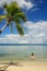 Young woman in bikini standing in clear water, Nananu-i-Ra island, Fiji