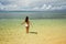 Young woman in bikini standing in clear water on Taveuni Island, Fiji