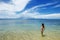 Young woman in bikini standing in clear water on Taveuni Island, Fiji