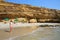 Young woman in bikini standing at La Mina Beach in Paracas National Reserve, Peru