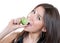 Young woman bite eat frsh lime