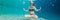 Young woman in black bikini in yoga position underwater in diving aquarium, full body shot, front view BANNER, long format
