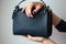 Young woman with black small handbag with perfect dark violet manicure