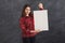 Young woman with blank white paper