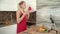 Young woman blogger in the kitchen. Woman makes a culinary video blog using a smartphone