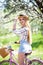 Young woman blonde hair summer style concept.standing near vintage pink bicycle have fun and good mood looking in camera and smili