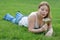 Young woman blowing dandelions