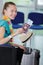 Young woman with boarding passes at departure hall