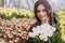 Young woman with a bouquet of spring flowers tulips. Soft selective focus, defocus