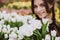 Young woman with a bouquet of spring flowers tulips. Soft selective focus, defocus