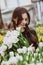 Young woman with a bouquet of spring flowers tulips. Soft selective focus, defocus