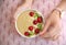 Young woman with bowl of healthy smoothie