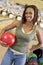 Young woman in a bowling ally