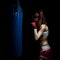 Young woman boxing on a punching bag