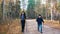 Young woman and a boy on scandinavian walk in the forest. Camping