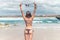 young woman without bra on the tropical beach of Bali island. Bikini girl freedom concept. Indonesia.