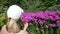 Young woman with bra white cap blow soap bubbles