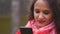 Young woman browsing the Internet on the phone, text messages and chatting outdoors.