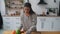 Young woman busy in modern kitchen, attractive girl preparing food